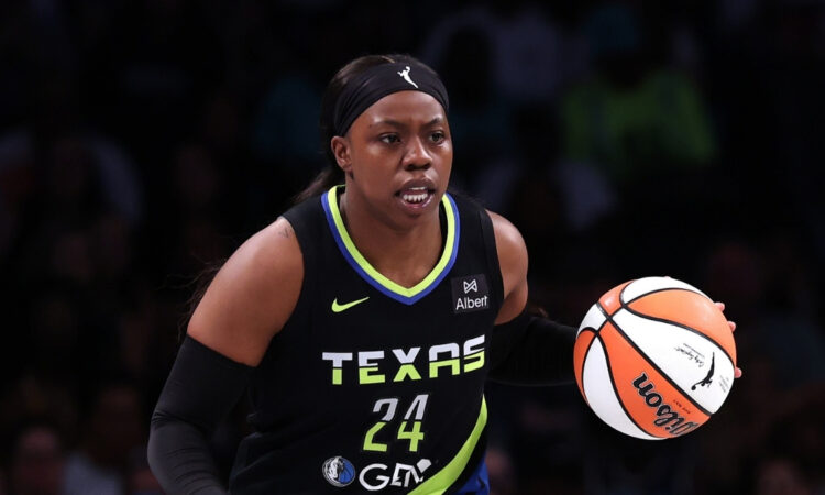 Arike Ogunbowale #24 of the Dallas Wings handles the ball during the first half against the New York Liberty at Barclays Center.