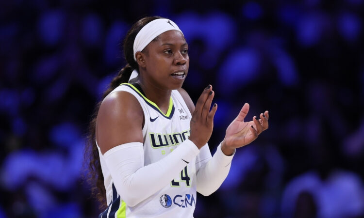 Arike Ogunbowale #24 of the Dallas Mavericks (Wings) reacts after a basket during the first half against the New York Liberty at College Park Center.