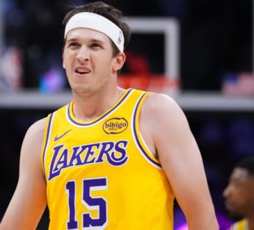 Austin Reaves #15 of the Los Angeles Lakers looks on during a game against the Miami Heat at Kaseya Center on March 19, 2026.