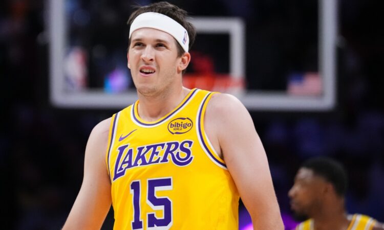 Austin Reaves #15 of the Los Angeles Lakers looks on during a game against the Miami Heat at Kaseya Center on March 19, 2026.