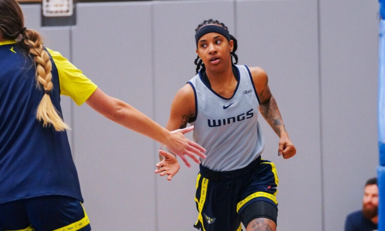 Dallas Wings guard Aziaha James and forward Alanna Smith during a 2026 training camp practice session in Arlington.