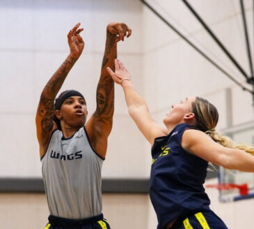 Aziaha James of the Dallas Wings shoots a step-back three-pointer over Paige Bueckers during the open portion of training camp at College Park Center.