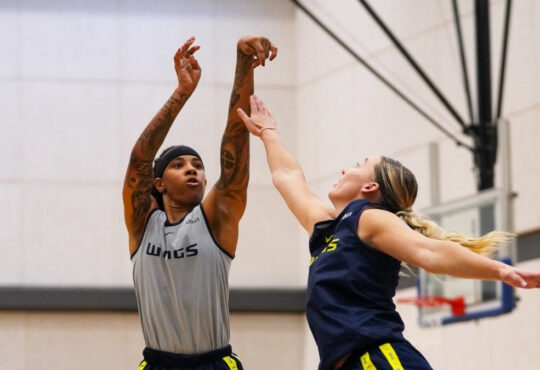 Aziaha James of the Dallas Wings shoots a step-back three-pointer over Paige Bueckers during the open portion of training camp at College Park Center.