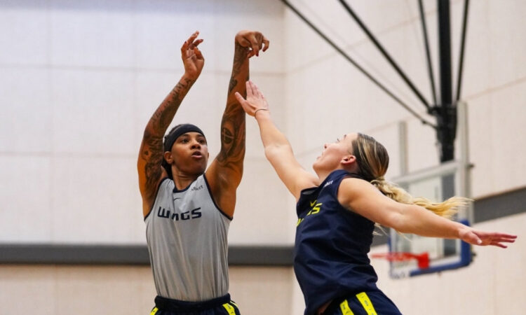 Aziaha James of the Dallas Wings shoots a step-back three-pointer over Paige Bueckers during the open portion of training camp at College Park Center.