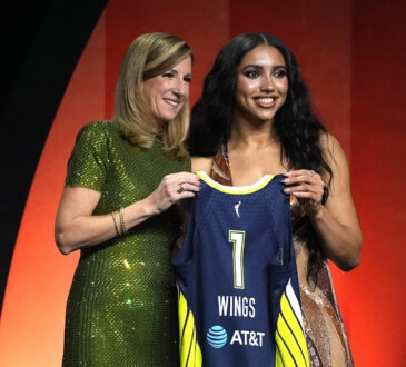 Azzi Fudd of UConn poses with WNBA Commissioner Cathy Engelbert after being selected No. 1 overall by the Dallas Wings at the 2026 WNBA Draft.