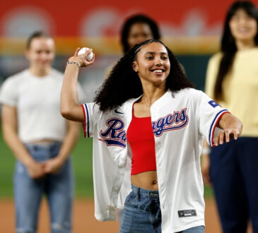 Dallas Wings rookie Azzi Fudd throws the ceremonial first pitch before the Texas Rangers vs. New York Yankees game at Globe Life Field.