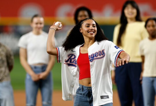 Dallas Wings rookie Azzi Fudd throws the ceremonial first pitch before the Texas Rangers vs. New York Yankees game at Globe Life Field.