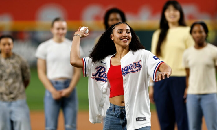 Dallas Wings rookie Azzi Fudd throws the ceremonial first pitch before the Texas Rangers vs. New York Yankees game at Globe Life Field.