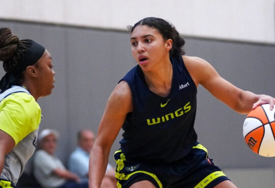 Dallas Wings rookie guard Azzi Fudd dribbles the ball while being defended by veteran guard Odyssey Sims during a 2026 training camp practice.