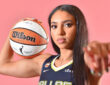 Azzi Fudd of the Dallas Wings poses in her home white uniform during her introductory press conference in Arlington, Texas.