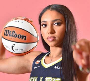Azzi Fudd of the Dallas Wings poses in her home white uniform during her introductory press conference in Arlington, Texas.