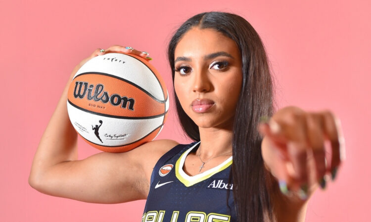 Azzi Fudd of the Dallas Wings poses in her home white uniform during her introductory press conference in Arlington, Texas.