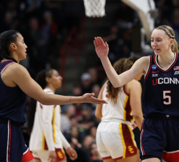 UConn guards Azzi Fudd and Paige Bueckers react during the second half of their Elite Eight victory over the USC Trojans in Spokane.
