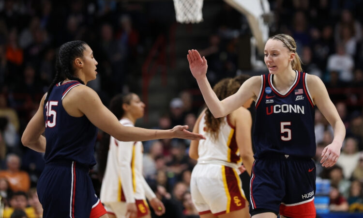 UConn guards Azzi Fudd and Paige Bueckers react during the second half of their Elite Eight victory over the USC Trojans in Spokane.