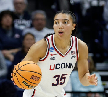 UConn Huskies guard Azzi Fudd handles the ball on a fast break during a second-round NCAA Tournament game against Syracuse at Gampel Pavilion.