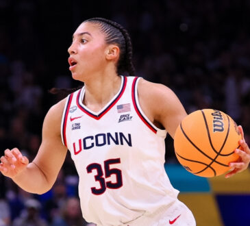 Azzi Fudd #35 of the UConn Huskies dribbles the ball during the NCAA Women's Final Four semifinal against South Carolina in Phoenix.