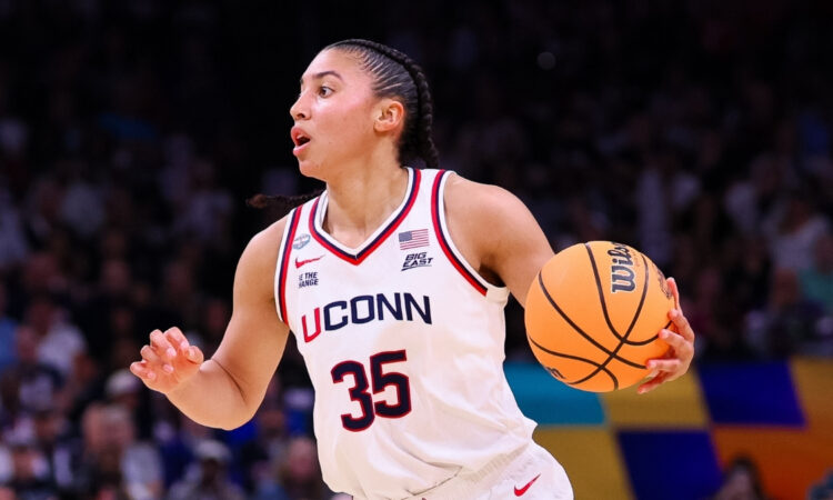 Azzi Fudd #35 of the UConn Huskies dribbles the ball during the NCAA Women's Final Four semifinal against South Carolina in Phoenix.