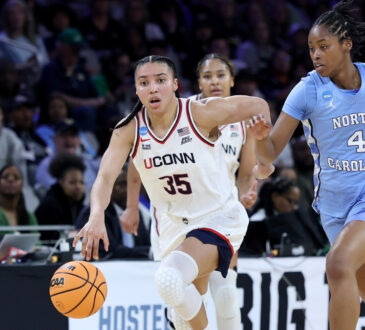 Azzi Fudd #35 of the UConn Huskies dribbles against Laila Hull of North Carolina during the NCAA Sweet Sixteen at Dickies Arena in Fort Worth.