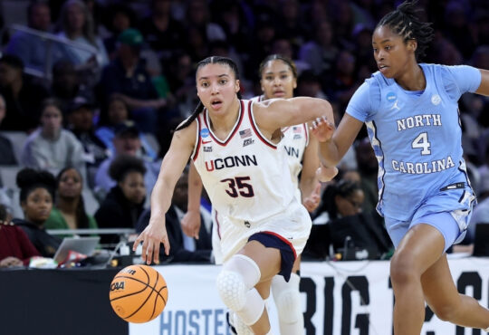 Azzi Fudd #35 of the UConn Huskies dribbles against Laila Hull of North Carolina during the NCAA Sweet Sixteen at Dickies Arena in Fort Worth.