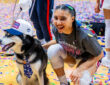 Azzi Fudd #35 of the UConn Huskies poses with Jonathan the Husky mascot after winning the Big East Tournament championship against Villanova.