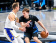 Cooper Flagg drives to the basket against Luke Kennard during the Dallas Mavericks' 134-128 win over the Los Angeles Lakers on April 5, 2026 at American Airlines Center in Dallas, Texas.
