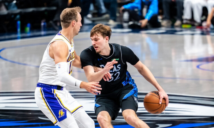 Cooper Flagg drives to the basket against Luke Kennard during the Dallas Mavericks' 134-128 win over the Los Angeles Lakers on April 5, 2026 at American Airlines Center in Dallas, Texas.