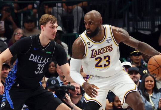 Cooper Flagg #32 of the Dallas Mavericks plays tight defense on LeBron James #23 of the Los Angeles Lakers during their April 5, 2026, game at American Airlines Center.