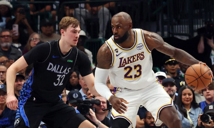 Cooper Flagg #32 of the Dallas Mavericks plays tight defense on LeBron James #23 of the Los Angeles Lakers during their April 5, 2026, game at American Airlines Center.