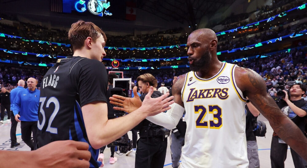 Cooper Flagg #32 of the Dallas Mavericks shakes hands with LeBron James #23 of the Los Angeles Lakers after a Mavericks win at American Airlines Center on April 5, 2026 in Dallas, Texas.