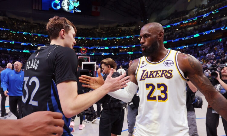 Cooper Flagg #32 of the Dallas Mavericks shakes hands with LeBron James #23 of the Los Angeles Lakers after a Mavericks win at American Airlines Center on April 5, 2026 in Dallas, Texas.