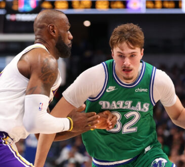 Cooper Flagg #32 of the Dallas Mavericks is defended by LeBron James #23 of the Los Angeles Lakers during the second half at American Airlines Center on January 24, 2026 in Dallas, Texas.