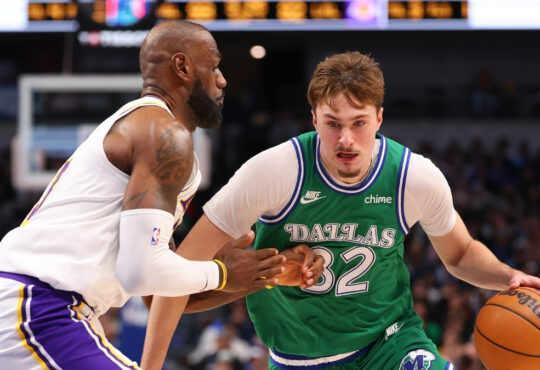 Cooper Flagg #32 of the Dallas Mavericks is defended by LeBron James #23 of the Los Angeles Lakers during the second half at American Airlines Center on January 24, 2026 in Dallas, Texas.