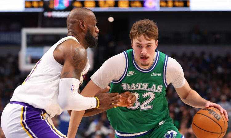 Cooper Flagg #32 of the Dallas Mavericks is defended by LeBron James #23 of the Los Angeles Lakers during the second half at American Airlines Center on January 24, 2026 in Dallas, Texas.