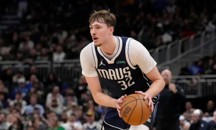 Cooper Flagg #32 of the Dallas Mavericks brings the ball up the court against the Milwaukee Bucks during the fourth quarter at Fiserv Forum on March 31, 2026.
