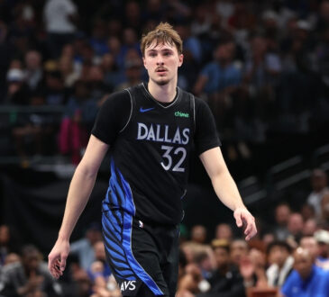 Cooper Flagg #32 of the Dallas Mavericks observes the action during the second quarter against the Minnesota Timberwolves at American Airlines Center.