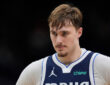 Cooper Flagg #32 of the Dallas Mavericks looks on during the fourth quarter of a game against the Milwaukee Bucks at Fiserv Forum.