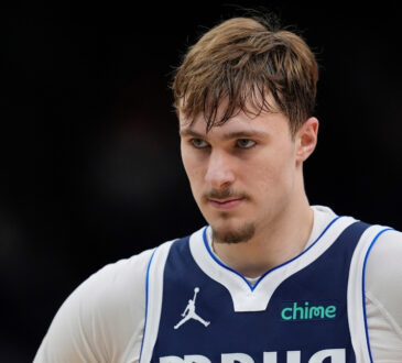 Cooper Flagg #32 of the Dallas Mavericks looks on during the fourth quarter of a game against the Milwaukee Bucks at Fiserv Forum.