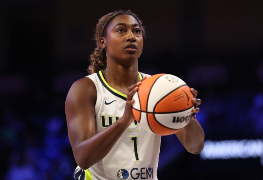 Diamond Miller #1 Dallas Wings shooting free throw against Connecticut Sun; trade cleared $259,088 in cap space.