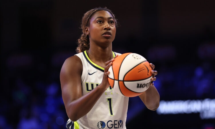 Diamond Miller #1 Dallas Wings shooting free throw against Connecticut Sun; trade cleared $259,088 in cap space.