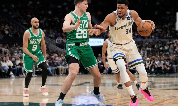 Giannis Antetokounmpo #34 of the Milwaukee Bucks dribbles against Hugo González #28 of the Boston Celtics at Fiserv Forum on March 02, 2026.