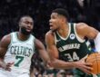 Giannis Antetokounmpo, a Celtics trade target, is defended by Boston's Jaylen Brown