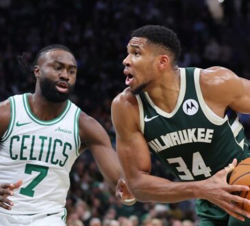 Giannis Antetokounmpo, a Celtics trade target, is defended by Boston's Jaylen Brown