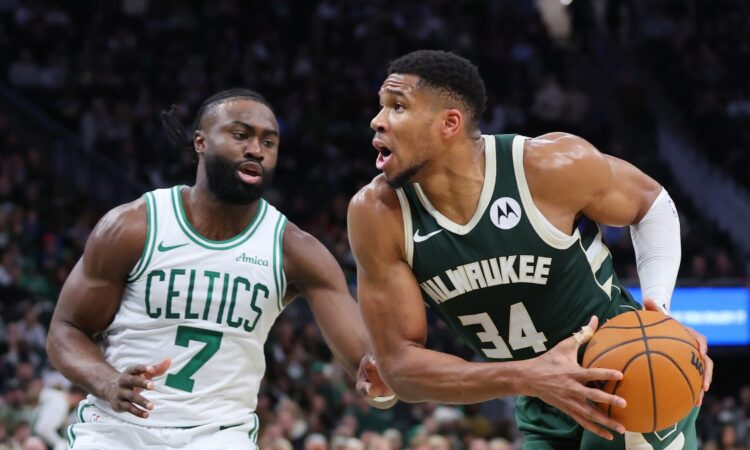 Giannis Antetokounmpo, a Celtics trade target, is defended by Boston's Jaylen Brown