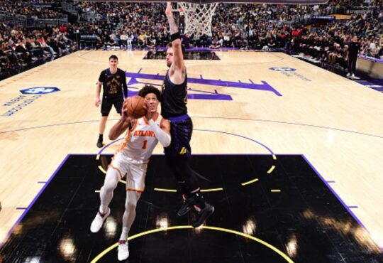 Jalen Johnson #1 of the Atlanta Hawks drives to the basket against Luka Doncic #77 of the Los Angeles Lakers at Crypto.com Arena on January 13, 2026.