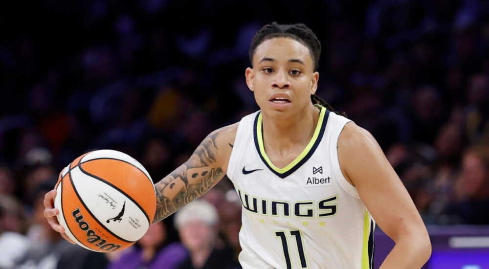 Dallas Wings guard JJ Quinerly dribbles at the point of attack against the Los Angeles Sparks at Crypto.com Arena.