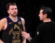 Los Angeles Lakers head coach JJ Redick talks with Luka Doncic #77 during a game against the Utah Jazz at Crypto.com Arena on November 18, 2025.