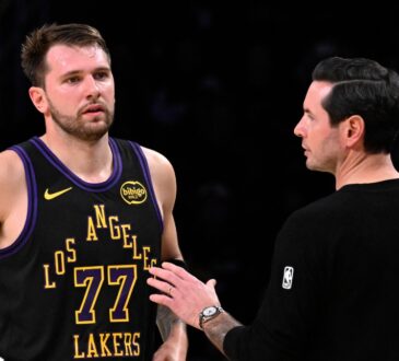 Los Angeles Lakers head coach JJ Redick talks with Luka Doncic #77 during a game against the Utah Jazz at Crypto.com Arena on November 18, 2025.