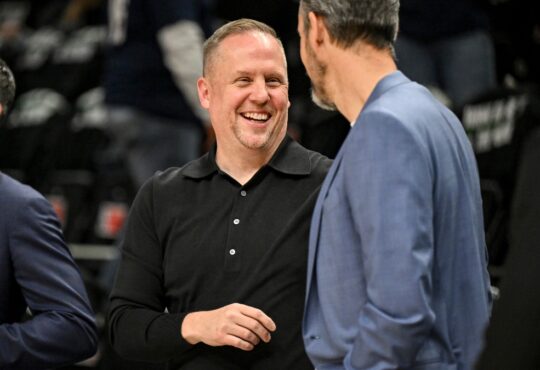 Josh Kroenke and Minnesota Timberwolves President of Basketball Operations Tim Connelly talk before Game 4 of the Western Conference Playoffs at Target Center on April 25, 2026.