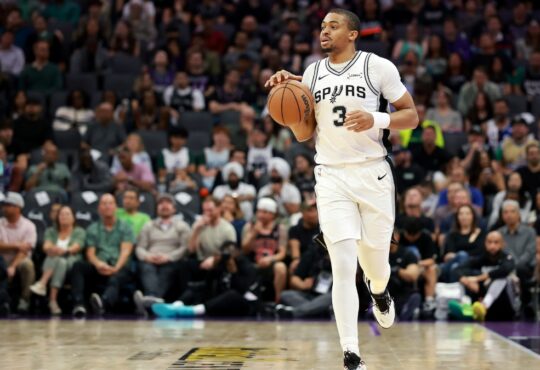 Keldon Johnson #3 of the San Antonio Spurs dribbles the ball during a game against the Sacramento Kings at Golden 1 Center on March 17, 2026.