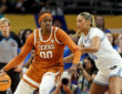 Kyla Oldacre #00 of the Texas Longhorns drives to the basket against Sienna Betts of the UCLA Bruins during the 2026 NCAA Women's Final Four in Phoenix.